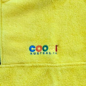 Coogi vibrant yellow, polyester pull over a quarter zip. Size men’s medium.